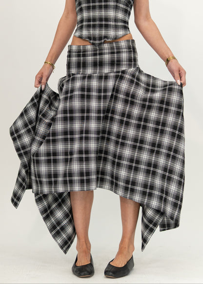 Mila Skirt in black and white plaid, front view showing the fitted hip yoke and asymmetric handkerchief hem, styled with the matching Alba Plaid top